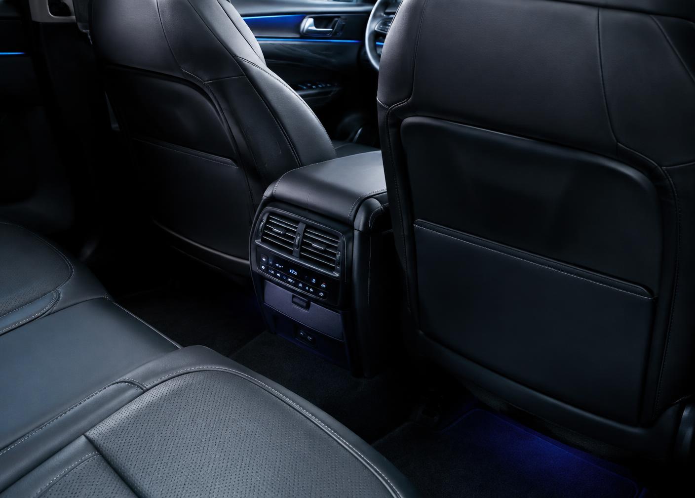 Spotless detailed black leather cabin with clean vents and console